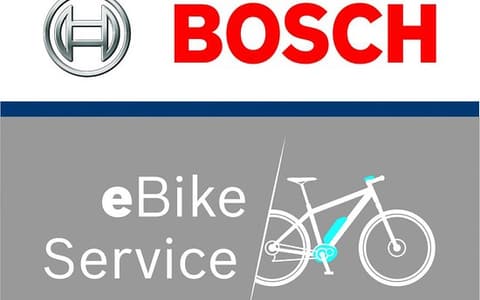 Doctor Bike technician using a Bosch diagnostic tool
